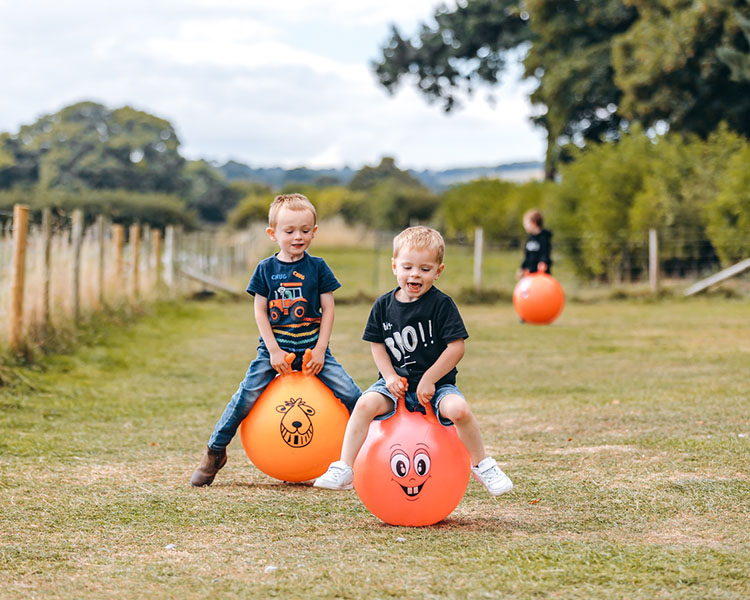 kids racing in the space hopper arena