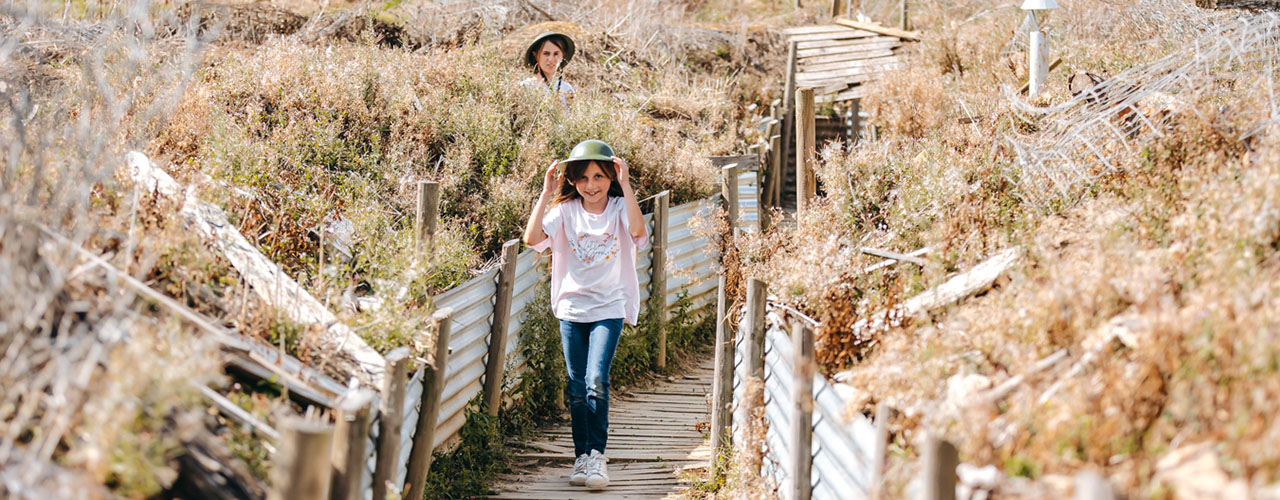 visitors walking through the trenches